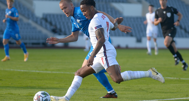 England's forward Raheem Sterling (front) and Iceland's defender Hjortur Hermannsson vie for the ball during the UEFA Nations League football match between Iceland v England on September 5, 2020 in Reykjavik. Haraldur Gudjonsson / AFP