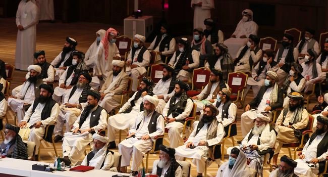 Members of the Taliban delegation attend the opening session of the peace talks between the Afghan government and the Taliban in the Qatari capital Doha on September 12, 2020. KARIM JAAFAR / AFP