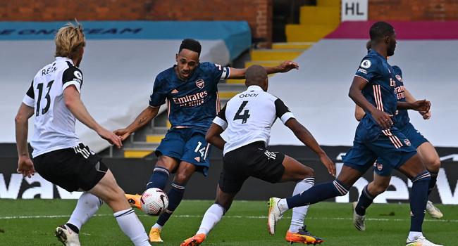 Arsenal's Gabonese striker Pierre-Emerick Aubameyang (2L) scores their third goal during the English Premier League football match between Fulham and Arsenal at Craven Cottage in London on September 12, 2020. Ben STANSALL / POOL / AFP
