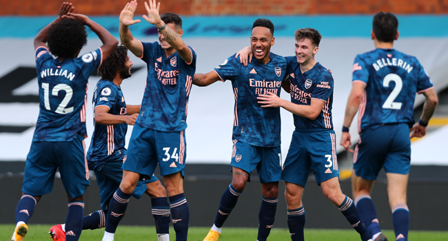 Arsenal's Gabonese striker Pierre-Emerick Aubameyang (C) celebrates scoring their third goal during the English Premier League football match between Fulham and Arsenal at Craven Cottage in London on September 12, 2020. Clive Rose / POOL / AFP