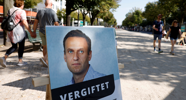 A poster with a picture of Russian opposition leader Alexei Navalny with the headline "poisoned" is seen outside the Russian embassy on Unter den Linden in Berlin during an anti-government protest on September 23, 2020. Odd ANDERSEN / AFP