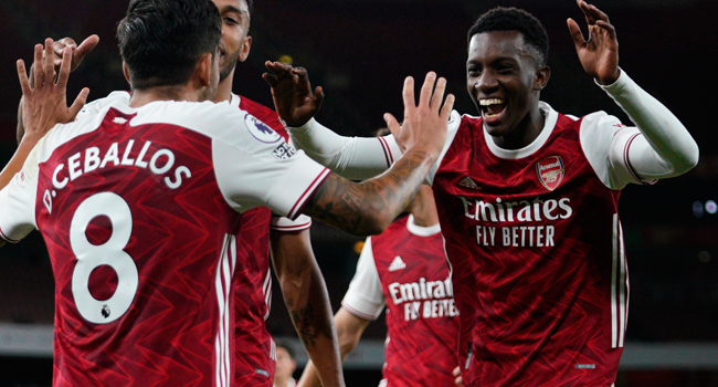 Arsenal's English striker Eddie Nketiah (R) celebrates scoring their second goal during the English Premier League football match between Arsenal and West Ham United at the Emirates Stadium in London on September 19, 2020. Will Oliver / POOL / AFP