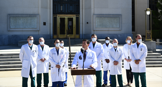 White House physician Sean Conley, with medical staff, gives an update on the condition of US President Donald Trump, on October 3, 2020, at Walter Reed Medical Center in Bethesda, Maryland. Trump was hospitalized on October 2 due to a Covid-19 diagnosis. Brendan Smialowski / AFP