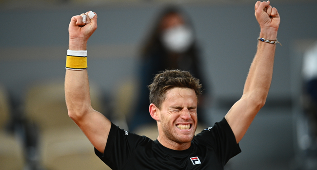Argentina's Diego Schwartzman celebrates after winning against Austria's Dominic Thiem at the end of their men's singles quarter-final tennis match on Day 10 of The Roland Garros 2020 French Open tennis tournament in Paris on October 6, 2020. Anne-Christine POUJOULAT / AFP
