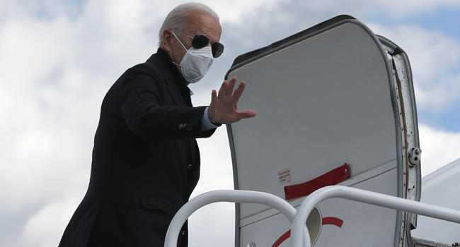 Democratic presidential nominee Joe Biden waves before traveling to Grand Rapids, Michigan, at New Castle County Airport October 2, 2020 in New Castle, Delaware. Chip Somodevilla/Getty Images/AFP