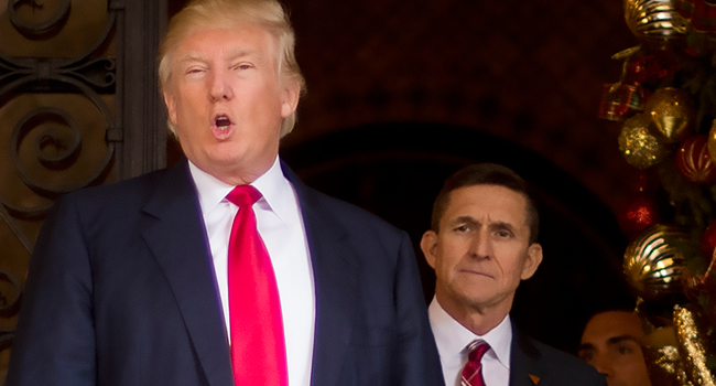  In this file photo taken on December 21, 2016 US President-elect Donald Trump (L) stands with Trump National Security Adviser designate Lt. General Michael Flynn (R) at Mar-a-Lago in Palm Beach, Florida. JIM WATSON / AFP