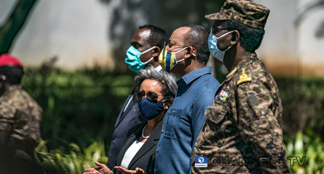 Sahle-Work Zewde (Center L), President of Ethiopia, stands next to Abiy Ahmed (Center R), Prime Minister of Ethiopia, during an event to honour the national defence forces in Addis Ababa, on November 17, 2020. EDUARDO SOTERAS / AFP