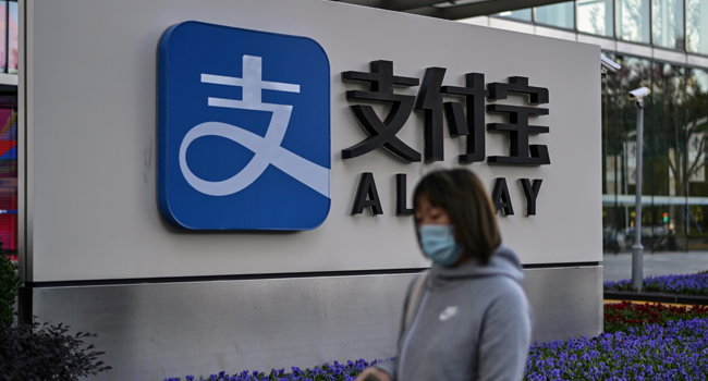 The logo of China's pioneering digital payments firm Alipay is pictured outside the office block of its parent company Ant Group in Shanghai on November 4, 2020. Hector RETAMAL / AFP
