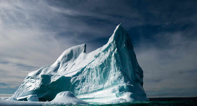 This file photo taken on June 29, 2019 shows an iceberg floating in Bonavista Bay in Newfoundland, Canada. The extent of sea ice in the Arctic was at record lows for October, Danish researchers said Wednesday, October 28, 2020, adding the unusually warm season meant it was not recovering as fast as normal. Johannes EISELE / AFP