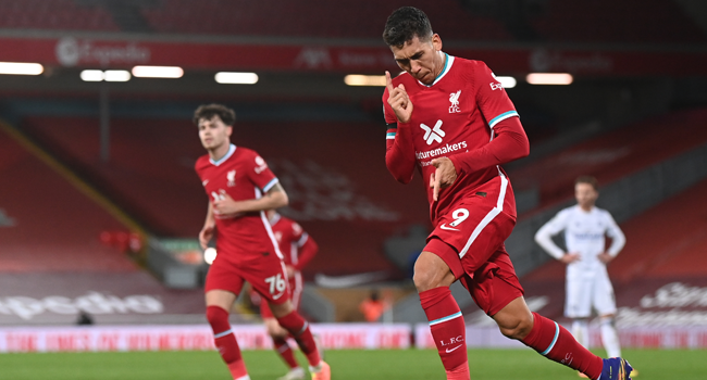 Liverpool's Brazilian midfielder Roberto Firmino celebrates after scoring a goal during the English Premier League football match between Liverpool and Leicester City at Anfield in Liverpool, north west England on November 22, 2020. Laurence Griffiths / POOL / AFP