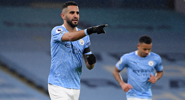 Manchester City's Algerian midfielder Riyad Mahrez celebrates after scoring his third goal, their fifth during the English Premier League football match between Manchester City and Burnley at the Etihad Stadium in Manchester, north west England, on November 28, 2020. Michael Regan / POOL / AFP