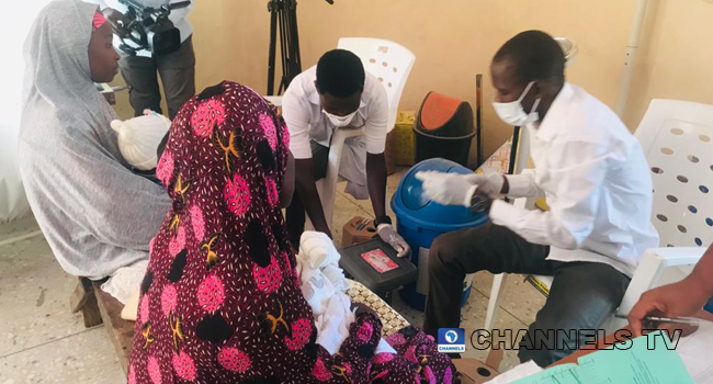 Healthcare professionals attend to mothers and their children in Jigawa.