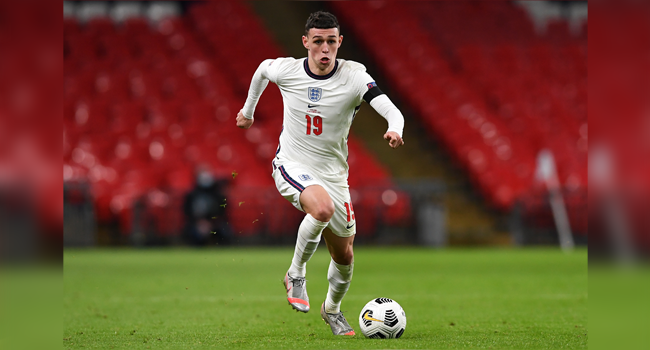 Englands's midfielder Phil Foden runs with the ball during the UEFA Nations League group A2 football match between England and Iceland at Wembley stadium in north London on November 18, 2020.  NEIL HALL / POOL / AFP