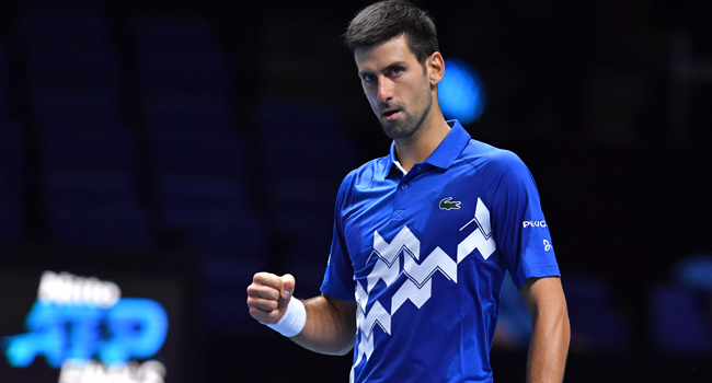 Serbia's Novak Djokovic reacts as he beats Germany's Alexander Zverev in straight sets in their men's singles round-robin match on day six of the ATP World Tour Finals tennis tournament at the O2 Arena in London on November 20, 2020. Glyn KIRK / AFP