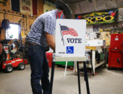 A voter marks his ballot at a polling place in Dennis Wilkening's shed on November 3, 2020 in Richland, Iowa. Mario Tama/Getty Images/AFP