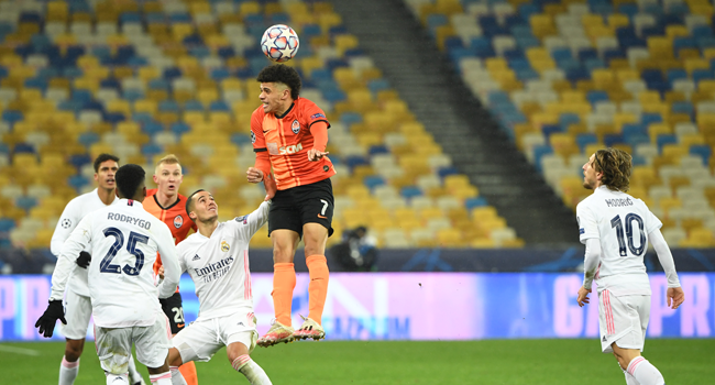 Shakhtar Donetsk's Brazilian midfielder Taison (C) heads the ball during the UEFA Champions League Group B football match between Shakhtar Donetsk and Real Madrid at the Olimpiyskiy stadium in Kiev on December 1, 2020. Sergei SUPINSKY / A