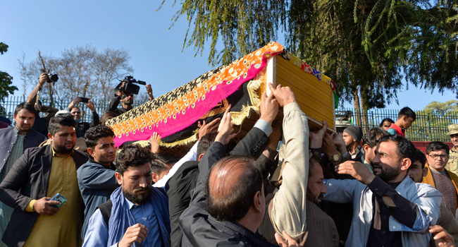 Mourners carry the coffin of female news anchor Malalai Maiwand, who was shot dead by gunmen in Jalalabad on December 10, 2020. NOORULLAH SHIRZADA / AFP
