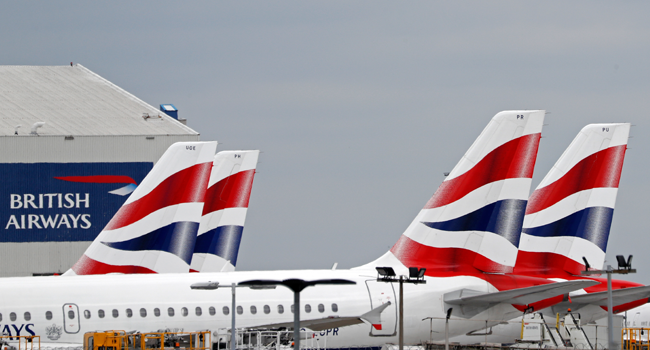 In this file photo taken on June 8, 2020 British Airways passenger planes are pictured at the apron at London Heathrow Airport in west London. Adrian DENNIS / AFP