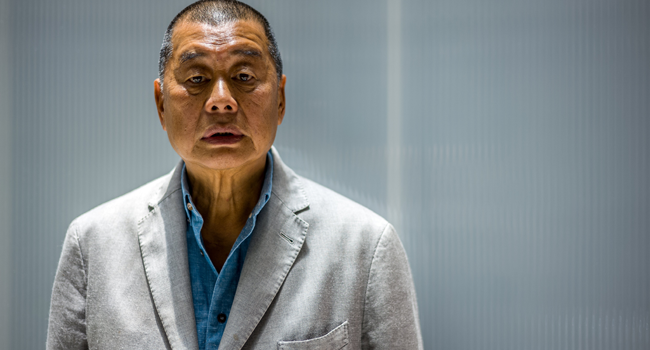 In this file photo taken on June 16, 2020, millionaire media tycoon Jimmy Lai, 72, poses during an interview with AFP at the Next Digital offices in Hong Kong. Anthony WALLACE / AFP