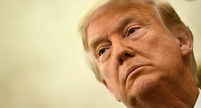 In this file photo taken on December 3, 2020 US President Donald Trump speaks before awarding the Presidential Medal of Freedom to retired football coach Lou Holtz in the Oval Office of the White House in Washington, DC. Brendan Smialowski / AFP