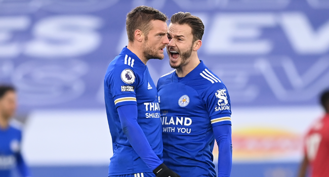 Leicester City's English striker Jamie Vardy (L) celebrates with Leicester City's English midfielder James Maddison (R) after scoring their second goal during the English Premier League football match between Leicester City and Manchester United at King Power Stadium in Leicester, central England on December 26, 2020. Michael Regan / POOL / AFP