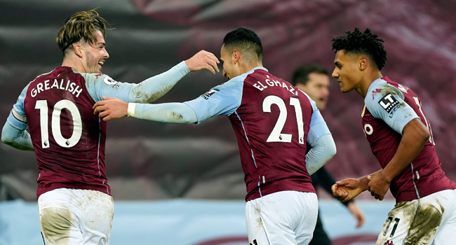 Aston Villa's English midfielder Jack Grealish (L) and Aston Villa's English striker Ollie Watkins (R) congratulate Aston Villa's Dutch striker Anwar El Ghazi after he scored their third goal during the English Premier League football match between Aston Villa and Crystal Palace at Villa Park in Birmingham, central England on December 26, 2020. Tim Keeton / POOL / AFP