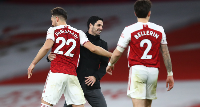 Arsenal's Spanish manager Mikel Arteta (C) xelebrates with Arsenal's Spanish defender Pablo Mari after the English Premier League football match between Arsenal and Chelsea at the Emirates Stadium in London on December 26, 2020. Julian Finney / POOL / AFP