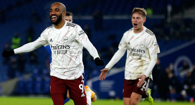 Arsenal's French striker Alexandre Lacazette celebrates scoring his team's first goal during the English Premier League football match between Brighton and Hove Albion and Arsenal at the American Express Community Stadium in Brighton, southern England on December 29, 2020. Frank Augstein / POOL / AFP