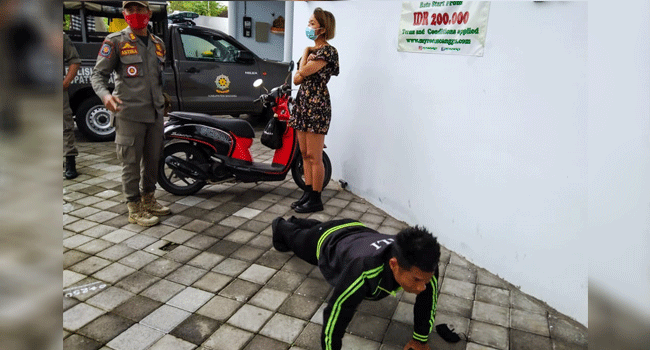 Foreigners Without Face Masks Punished With Push-Ups In Bali