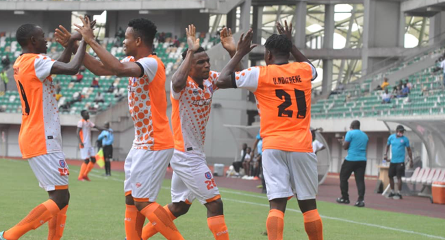 Akwa United Players celebrate during a league match.