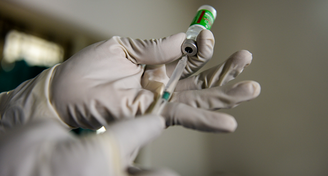 A health worker prepares to inoculate a private hospital staff with a Covid-19 vaccine in Hyderabad on January 28, 2021. Noah SEELAM / AFP