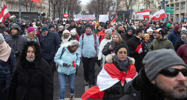 Demonstrators march without masks during a protest against the novel coronavirus (Covid-19) restrictions at the Ringstrasse in Vienna, Austria on January 16, 2021. ALEX HALADA / AFP