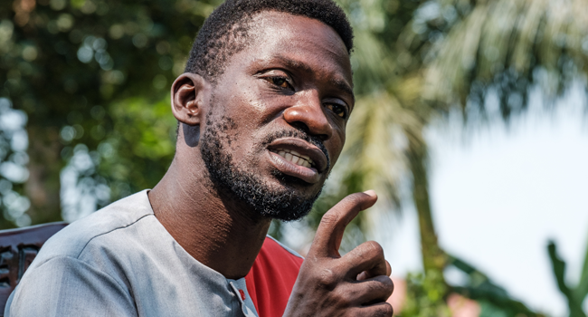 Musician turned politician Robert Kyagulanyi, aka Bobi Wine, addresses the media at his home in Wakiso, Uganda, on January 8, 2021 to announce his plans to take President Yoweri Museveni to the International Court Commission (ICC), accusing him of crimes against humanity over the past few months. SUMY SADURNI / AFP