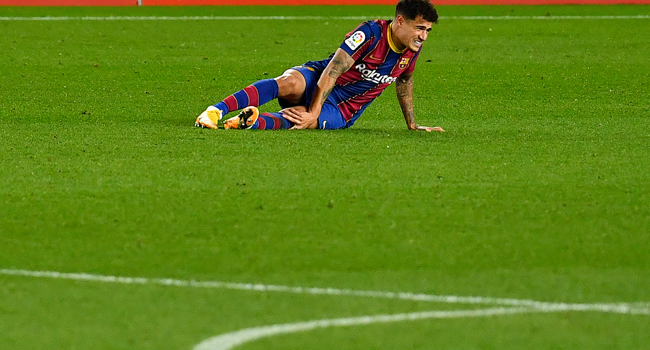 Barcelona's Brazilian midfielder Philippe Coutinho reacts after falling during the Spanish League football match between Barcelona and Eibar at the Camp Nou stadium in Barcelona on December 29, 2020. Pau BARRENA / AFP