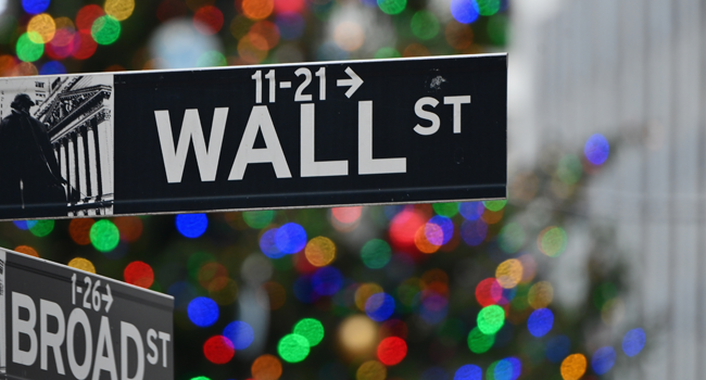 In this file photo taken on December 09, 2020 the Wall Street sign at the New York Stock Exchange (NYSE) is seen in New York City. Angela Weiss / AFP