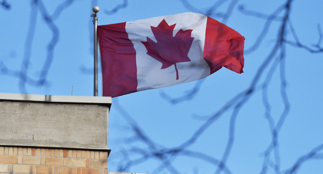 In this file photo the Canadian flag flies above the Canadian embassy in Beijing on January 15, 2019. GREG BAKER / AFP