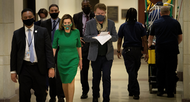 Speaker of the House Nancy Pelosi (D-CA) walks to a press conference about Covid-19 financial relief and minimum wage on Capitol Hill February 26, 2021, in Washington, DC. Brendan Smialowski / AFP