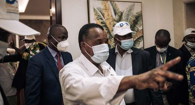 Re-elected Congo's President Denis Sassou Nguesso (C) greets his entourage and campaign team at the headquarters of the Congolese Labor Party (PCT) presidential party in Brazzaville on March 23, 2021. ALEXIS HUGUET / AFP