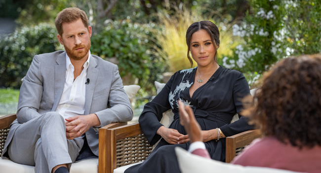 This undated image released March 7, 2021 courtesy of Harpo Productions shows Britain's Prince Harry (L) and his wife Meghan (C), Duchess of Sussex, in a conversation with US television host Oprah Winfrey. Joe PUGLIESE / HARPO PRODUCTIONS / AFP