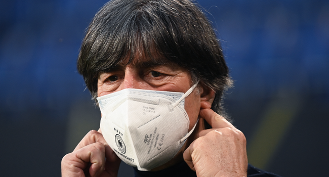 Germany's coach Joachim Loew wears a face mask as he arives for the FIFA World Cup Qatar 2022 qualification football match Germany v North Macedonia in Duisburg, western Germany on March 31, 2021. Ina Fassbender / AFP