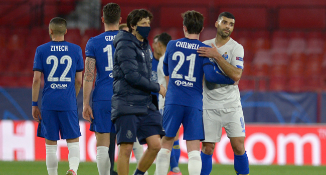 Chelsea's English defender Ben Chilwell (2R) congratulates FC Porto's Iranian forward Mehdi Taremi after the UEFA Champions League quarter final second leg football match between Chelsea and Porto at the Ramon Sanchez Pizjuan stadium in Seville on April 13, 2021. CRISTINA QUICLER / AFP