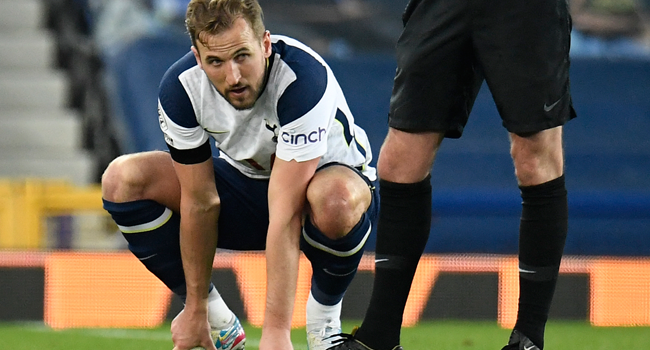 Tottenham Hotspur's English striker Harry Kane holds his foot before leaving the pitch injured during the English Premier League football match between Everton and Tottenham Hotspur at Goodison Park in Liverpool, north west England on April 16, 2021. PETER POWELL / POOL / AFP