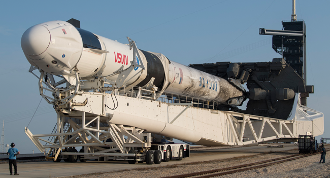 In this image released by NASA, a SpaceX Falcon 9 rocket with the company's Crew Dragon spacecraft onboard is rolled out of the horizontal integration facility at Launch Complex 39A during preparations for the Crew-2 mission, on April 16, 2021, at Kennedy Space Center in Florida. Aubrey GEMIGNANI / NASA / AFP