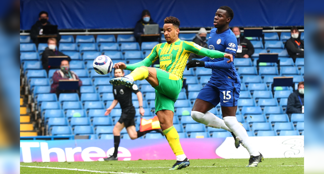 West Bromwich Albion's Brazilian midfielder Matheus Pereira (L) scores his team's opening goal during the English Premier League football match between Chelsea and West Bromwich Albion at Stamford Bridge in London on April 3, 2021. Clive Rose / POOL / AFP