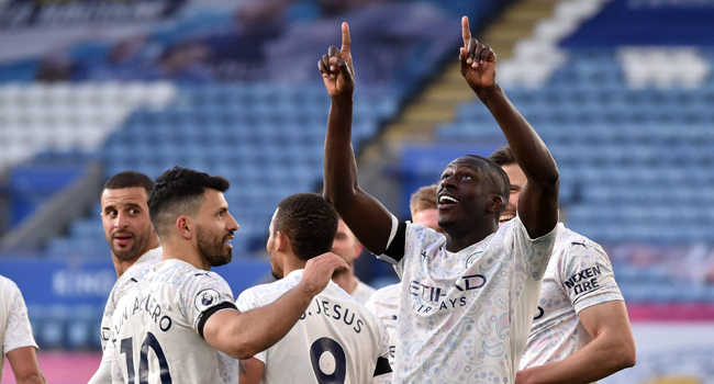 Manchester City's French defender Benjamin Mendy (R) celebrates scoring the opening goal during the English Premier League football match between Leicester City and Manchester City at King Power Stadium in Leicester, central England on April 3, 2021. Rui Vieira / POOL / AFP