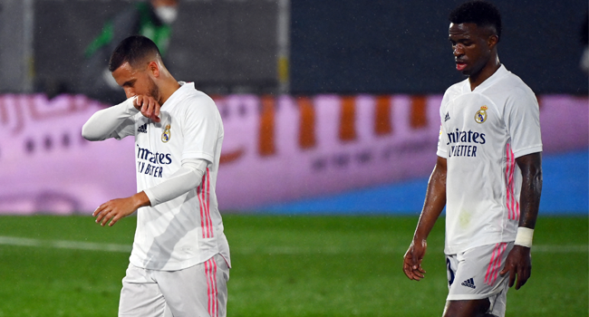 Real Madrid's Belgian forward Eden Hazard (L) and Real Madrid's Brazilian forward Vinicius Junior leave the pitch at the end of the Spanish League football match between Real Madrid CF and Real Betis at the Alfredo di Stefano stadium in Valdebebas, on the outskirts of Madrid, on April 24, 2021. GABRIEL BOUYS / AFP