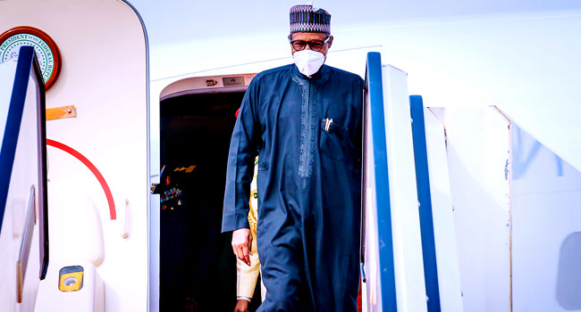 Buhari Returns To Abuja After Attending African Finance Summit In France