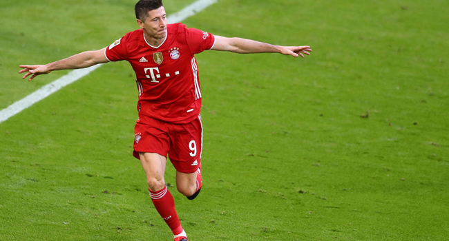 Bayern Munich's Polish forward Robert Lewandowski celebrates after scoring the 3-0 during the German first division Bundesliga football match FC Bayern Munich v Borussia Moenchengladbach in Munich, southern Germany on May 8, 2021. MATTHIAS SCHRADER / POOL / AFP