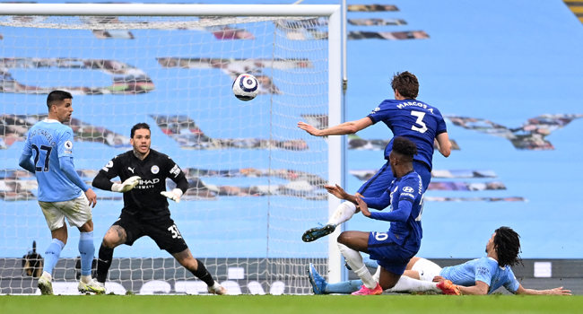 Chelsea's Spanish defender Marcos Alonso (2nd R) shoots to score their late winner during the English Premier League football match between Manchester City and Chelsea at the Etihad Stadium in Manchester, north west England, on May 8, 2021. Chelsea won the game 2-1. Laurence Griffiths / POOL / AFP