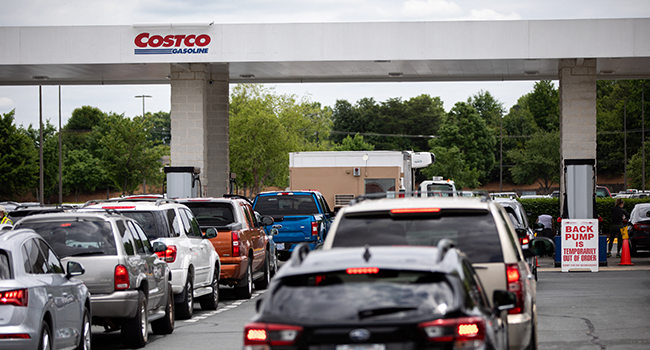 Cars line up to fill their gas tanks at a COSTCO at Tyvola Road in Charlotte, North Carolina on May 11, 2021. Logan Cyrus / AFP